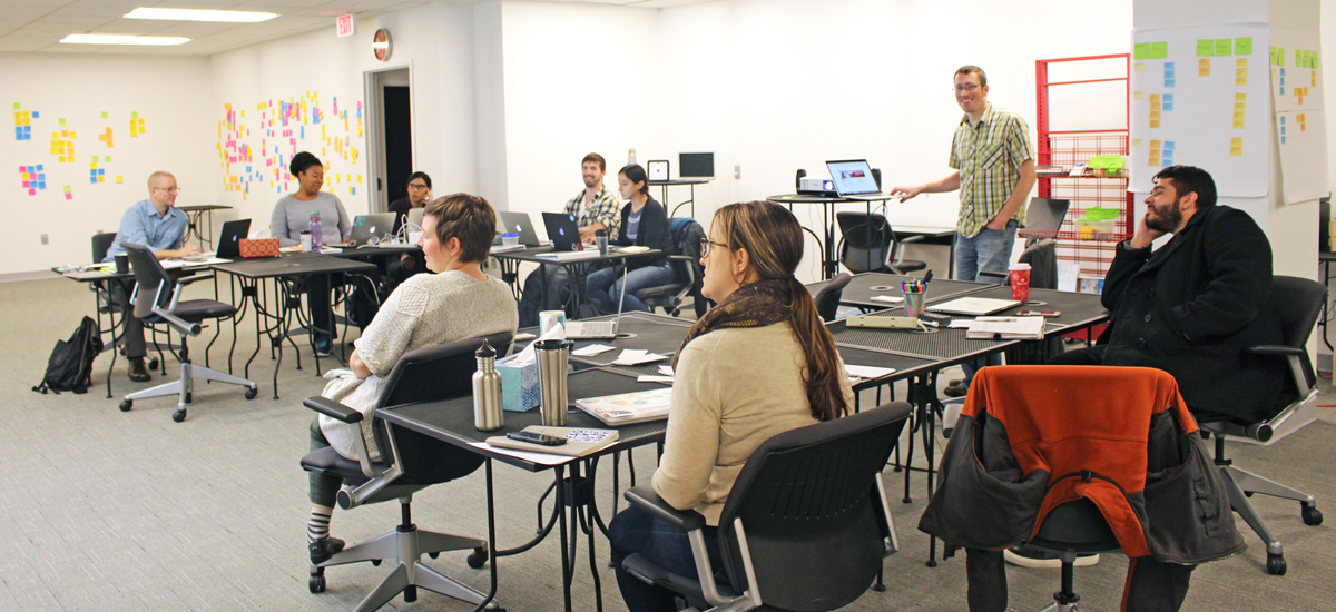 A photo of students and staff participating in Abby Covert's workshop